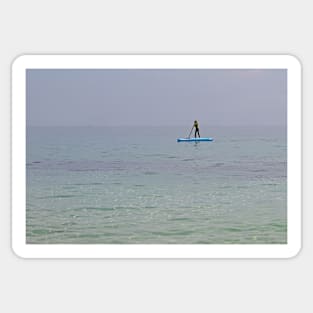 Paddle boarder in the sea off the Isle of Herm, Channel Islands Sticker